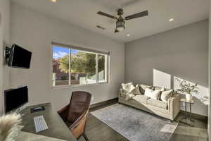 Office space featuring ceiling fan and wood-type flooring