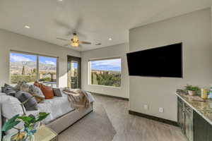 Bedroom featuring ceiling fan and a textured ceiling