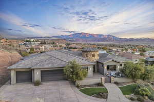 View of front facade featuring a mountain view and a garage