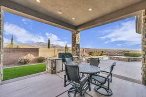 View of patio / terrace with a mountain view and exterior kitchen