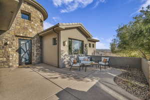 View of patio featuring an outdoor hangout area