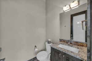 Bathroom featuring vanity and toilet