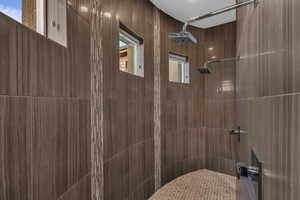 Bathroom featuring tiled shower