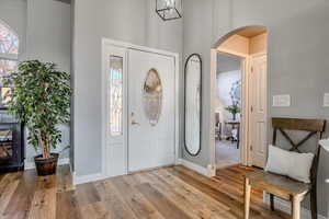 Foyer featuring a high ceiling and light hardwood / wood-style flooring