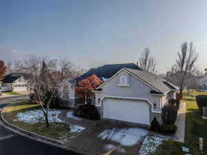 View of front of home with central AC unit