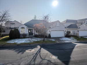 View of front facade featuring a garage