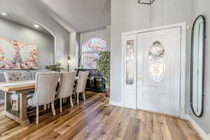 Entrance foyer with hardwood / wood-style flooring