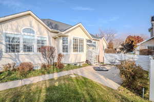 View of front of home featuring a front yard and a patio