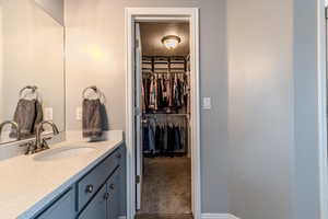 Bathroom featuring vanity and a textured ceiling