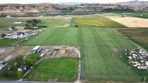 Drone / aerial view with a mountain view and a rural view