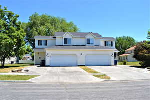 View of property with a garage