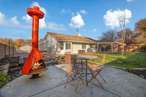 View of patio / terrace featuring a fireplace