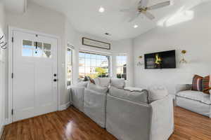 Living room featuring ceiling fan and dark hardwood / wood-style floors