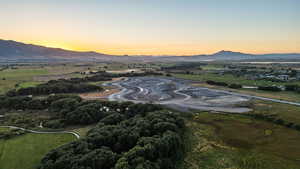 Aerial view at dusk with a mountain view and a rural view