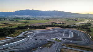 Aerial view at dusk featuring a mountain view