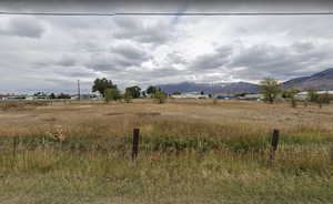 View of landscape featuring a mountain view and a rural view