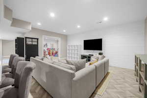 Living room featuring light parquet floors