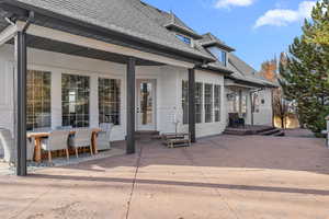 Back of property with a patio