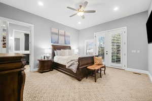 Carpeted bedroom featuring access to exterior, french doors, and ceiling fan