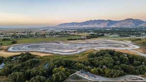 Aerial view at dusk featuring a mountain view