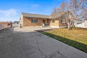 Front of home with large grassy front yard