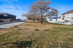 Front of home with large grassy front yard