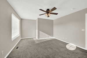 Unfurnished room with carpet flooring and ceiling fan