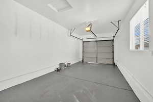 Garage featuring a garage door opener