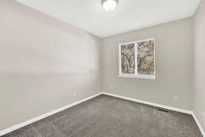 Empty room featuring carpet floors