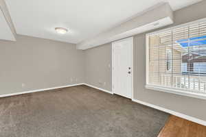 Empty room featuring dark wood-type flooring