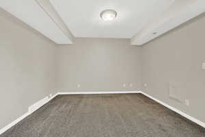 Basement with carpet flooring