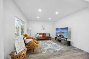 Living room with light hardwood / wood-style floors