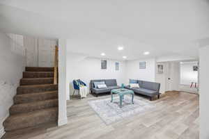 Living room with light wood-type flooring