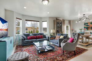 Living room featuring a notable chandelier