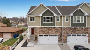 View of front facade featuring a garage