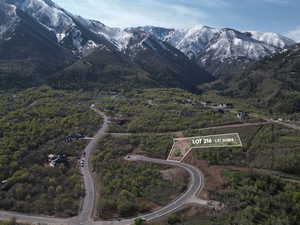 Exterior space featuring a forest view and a mountain view