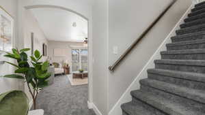 Stairway with carpet and ceiling fan