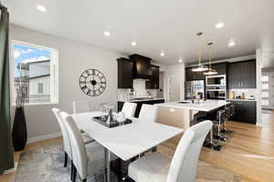 Dining room featuring light wood-type flooring and sink