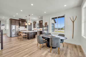 Dining area featuring light hardwood / wood-style flooring and sink