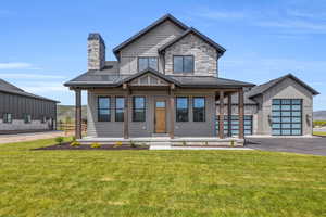 View of front facade with a porch and a front yard