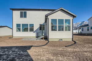 Rear view of house with a mountain view