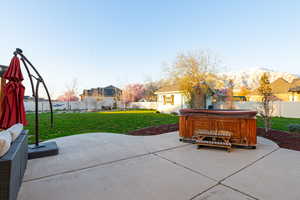 View of patio featuring a mountain view and a hot tub