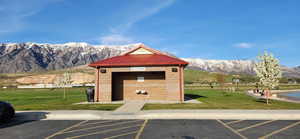 View of outdoor structure with a lawn and a mountain view