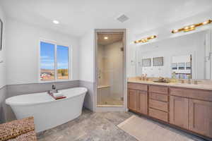 Bathroom with plus walk in shower and vanity