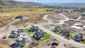 Birds eye view of property with a mountain view