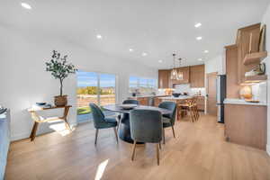 Dining area with light wood-type flooring