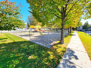 View of play area featuring a lawn