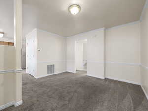 Unfurnished room with carpet and ornamental molding