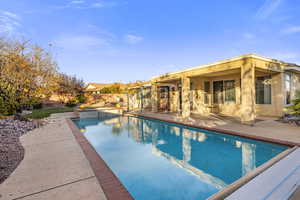 View of swimming pool with a patio