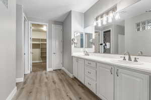 Bathroom featuring hardwood / wood-style floors and vanity